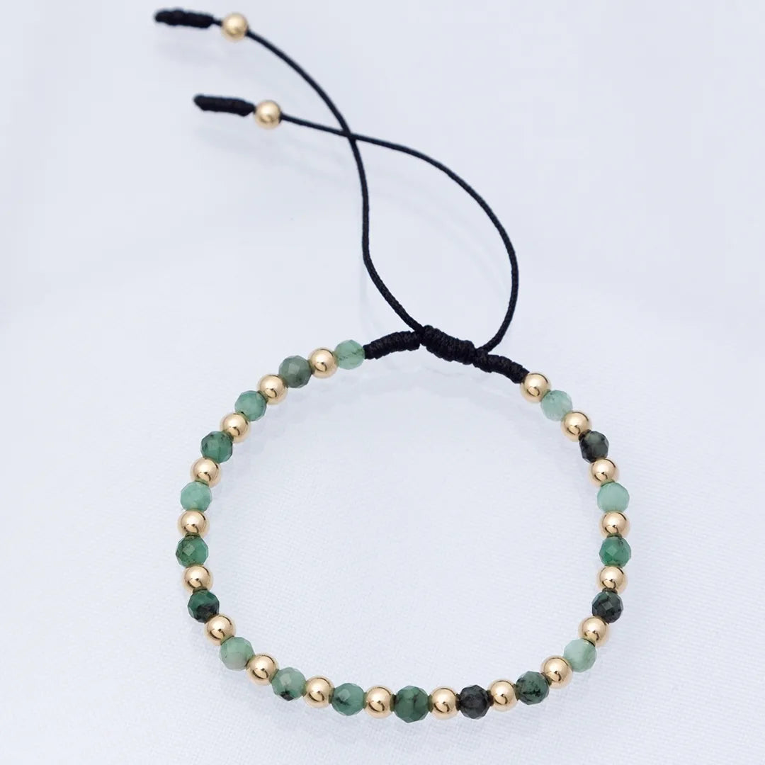 JOYA DE ESMERALDAS Y BALINES LISOS EN PULSERA